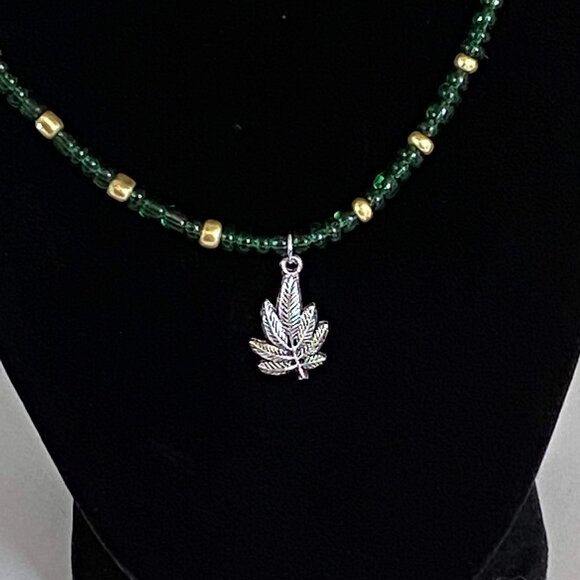 Green and Gold Marijuana Leaf Necklace - Picture 1 of 4